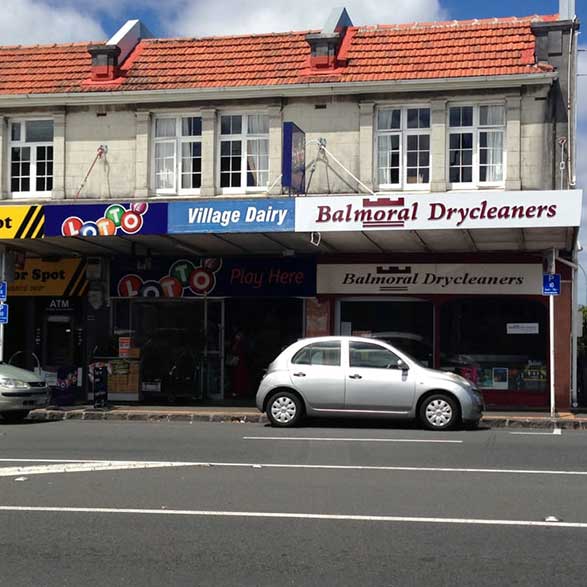 Gray Car in front of the Balmoral Drycleaners Store